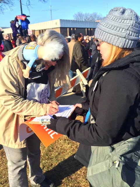 Kelly Collison, founder of Michigan for Revolution, signs up a woman who supported Vermont Sen. Bernie Sanders in the Democratic presidential primary. - VIOLET IKONOMOVA
