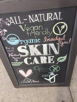 Advertisement for "gluten-free" beauty products taken outside a store in Buffalo, New York. - PHOTO BY JANE SLAUGHTER