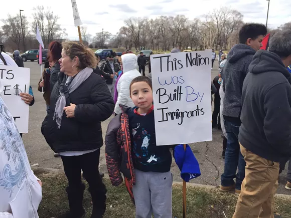 A little boy protests the Trump administration's immigration agenda in southwest Detroit on 'A Day Without Immigrants." - Violet Ikonomova