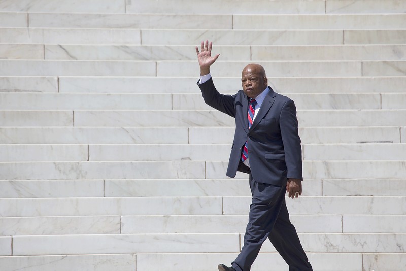 Georgia Congressman John Lewis waves at the 50th Anniversary of the march on Washington and Martin Luther King's I Have A Dream Speech in 2013. - Joseph Sohm, Shutterstock