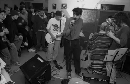 A band captured mid-set at the Zone Coffee house on Michigan Avenue on the east end of Dearborn. Harkness says it was open "from 1994 to early 1998, when it was closed by the Dearborn Police." No fun, indeed. - Photo courtesy Bruce Harkness