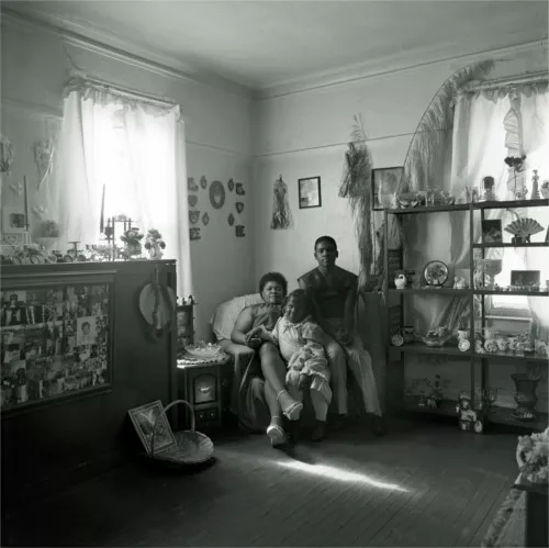 A shot of the Guyton Family, Lillian (mother), Carllitta, and Andre, who lived in a small, four-unit, wood-sided apartment building on Dubois Street at Willis. Harkness says, "Today there is no evidence that a structure ever stood on that corner." - Photo courtesy Bruce Harkness