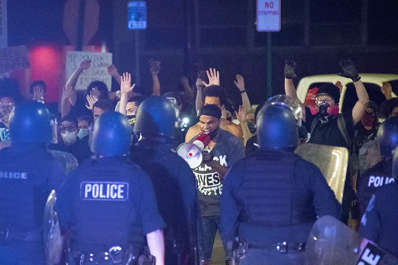 Police clashed with protesters on Woodward on Sunday morning. - Adam J. Dewey