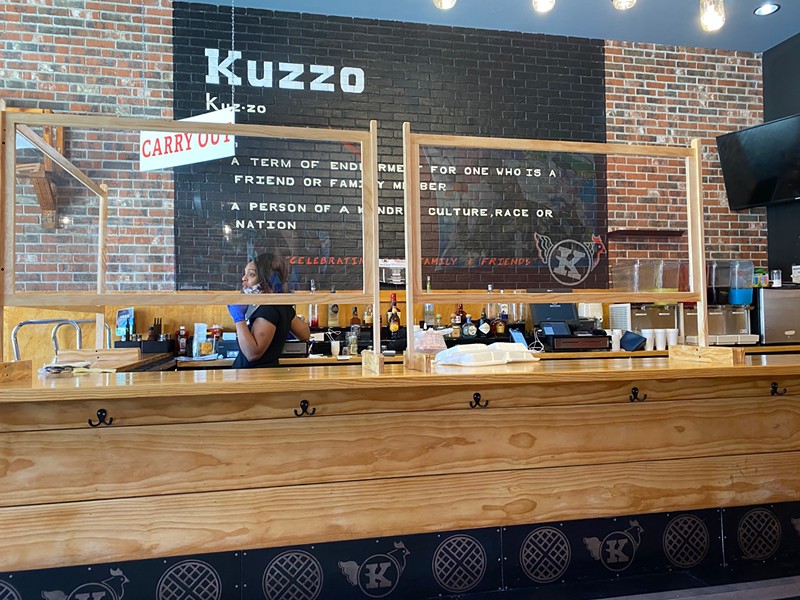 The coronavirus crisis came to Michigan just as Detroit's Kuzzo's Chicken & Waffles returned from a hiatus. The restaurant was forced to quickly adapt, installing plexiglass panes and pivoting to takeout service. - David Rudolph PR