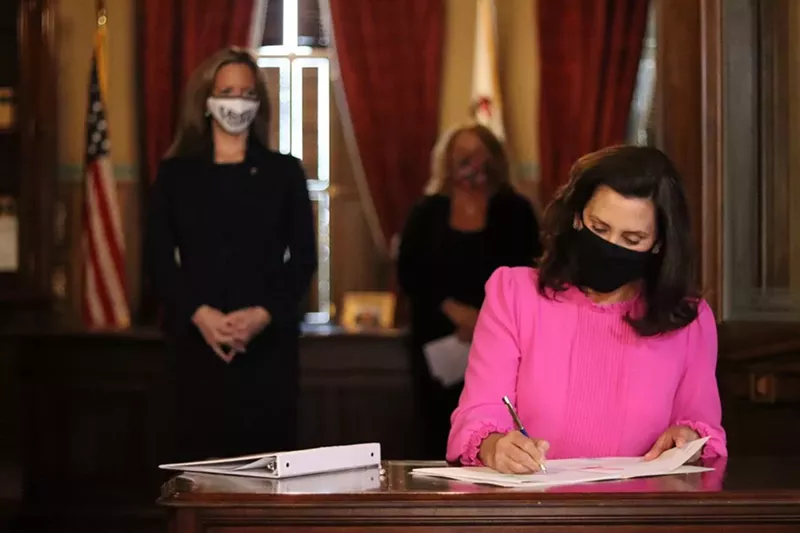 Gov. Gretchen Whitmer signs a previous bill. - Gov. Gretchen Whitmer's Office