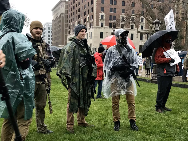 Protesters with rifles outside the state Capitol - Steve Neavling