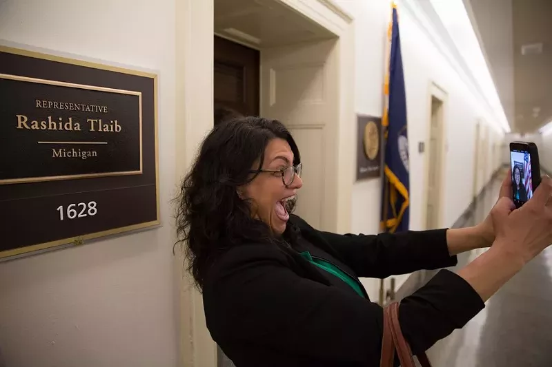 Rashida Tlaib snaps a selfie in front of her new office in 2019. - Erik Paul Howard