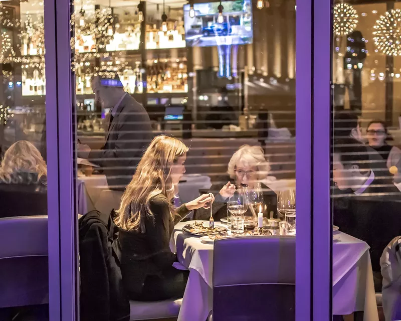 Two women eating at Detroit's Parc in 2019. - Craig Loyer / Shutterstock