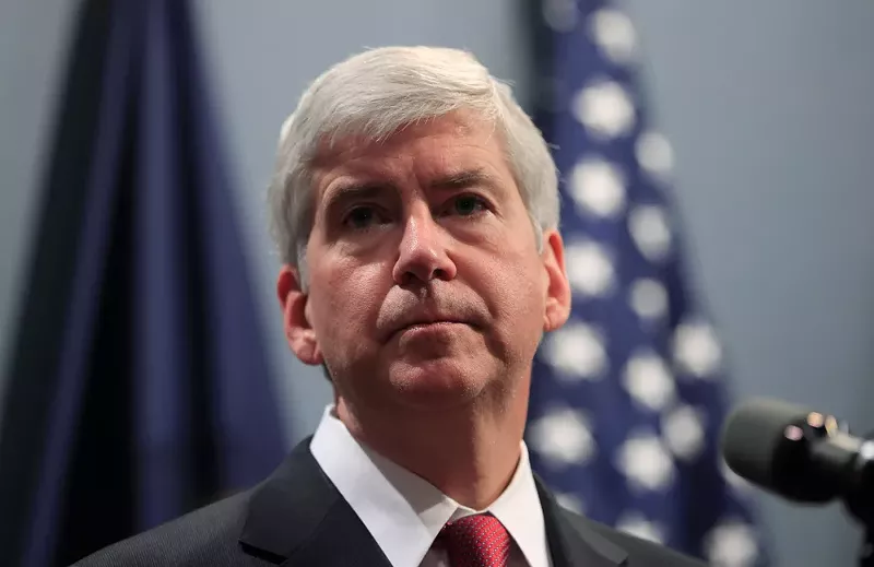 Former Michigan Governor Rick Snyder faces charges of willful neglect in the Flint water crisis. - vasilis asvestas / Shutterstock.com