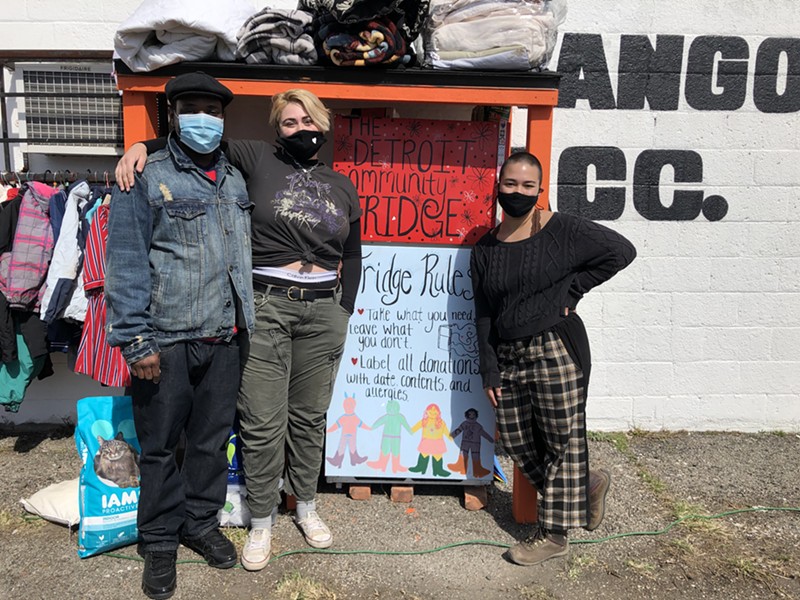 Ryan Yeargin (left) of the east side business Hats Galore & More partnered with Kazza Kitchell (center) and Alyssa Rogers (right) of Detroit Community Fridge, a mutual aid organization that's setting up free refrigerators and pantries in the city. - Lee DeVito