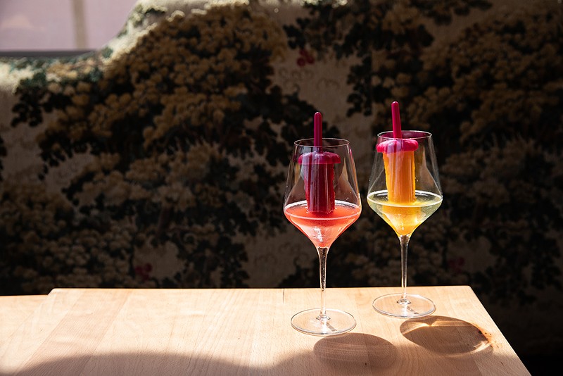 Pinky's Ice Pops — a glass of wine glass with a liquor-infused ice popsicle sticking out of it. - Courtesy photo
