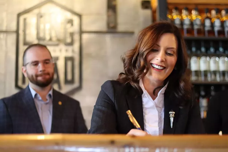 Gov. Whitmer signing bills, which will make it easier for distillers and retailers to distribute and sell mixed spirit drinks. - State of Michigan