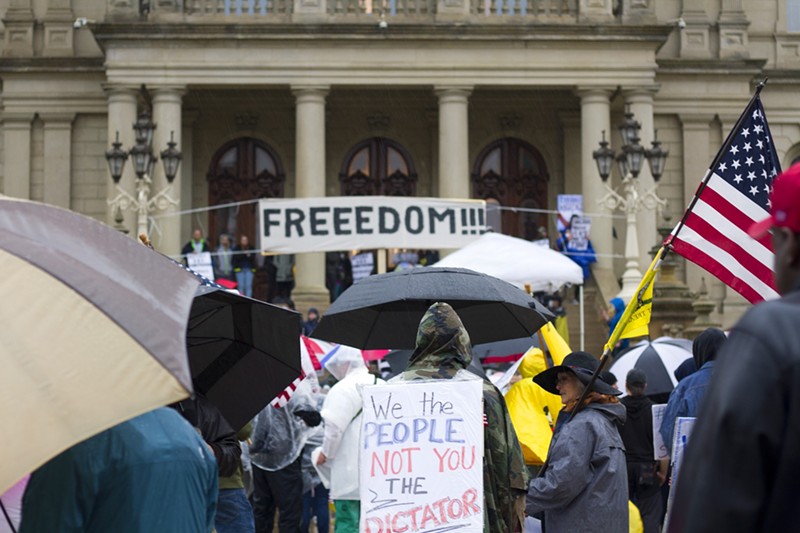 Protesters rallied against COVID-19 restrictions in Lansing in May 2020. - STEVE NEAVLING