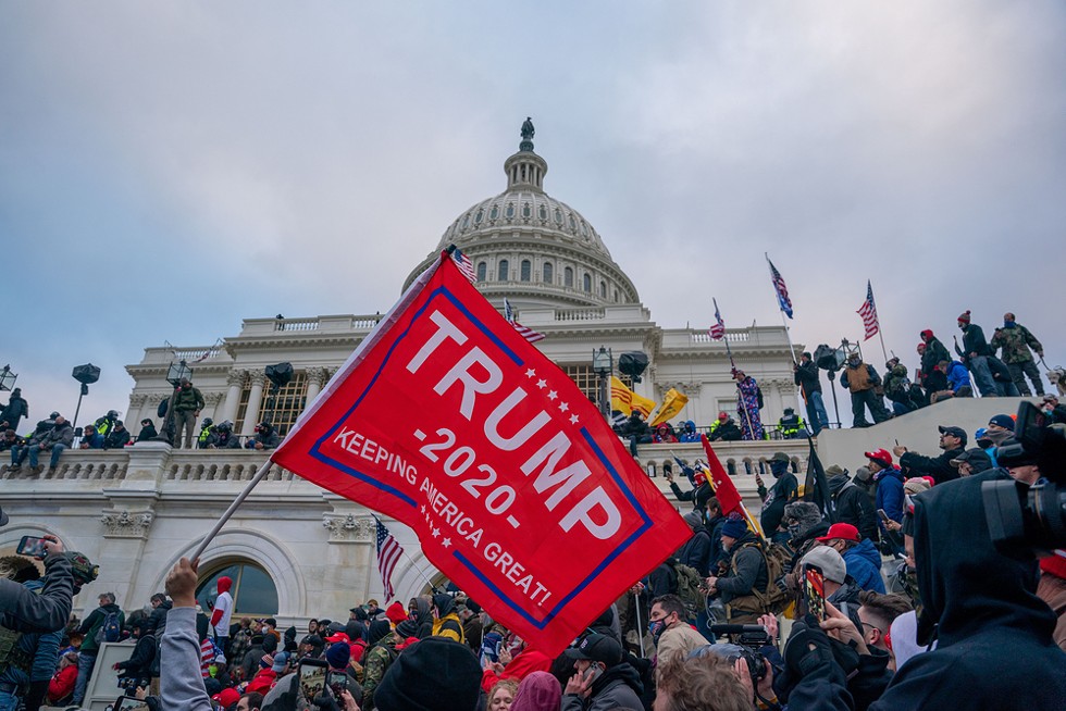 Trump supporters storm the United States Capitol building. - Thomas Hengge / Shutterstock.com