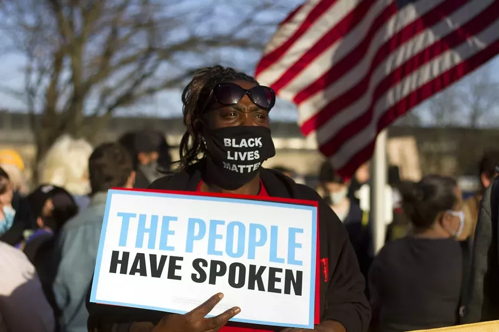 Dozens of revelers gathered in Detroit's New Center on Saturday, soon after the Associated Press and major networks called Joe Biden the winner of the 2020 presidential election. - STEVE NEAVLING