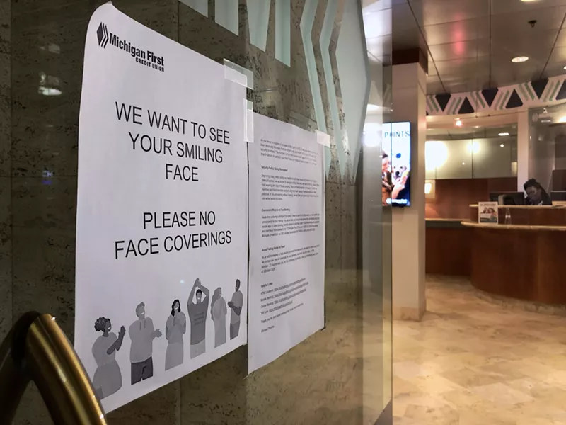 Michigan First Credit Union wants to see its members "smile" and asks them not to wear masks inside its branches. - STEVE NEAVILNG
