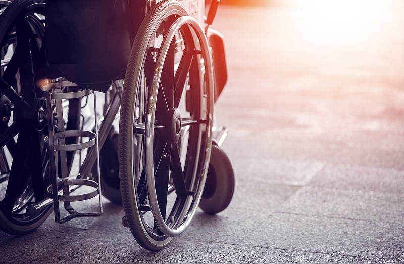 A local activist in a wheelchair has filed suit against a municipal lawyer over demeaning emails. - Shutterstock