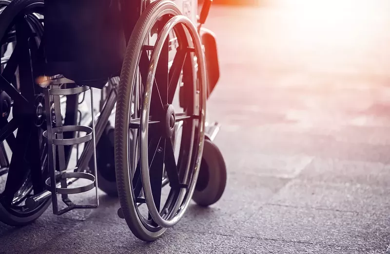 A local activist in a wheelchair has filed suit against a municipal lawyer over demeaning emails. - Shutterstock