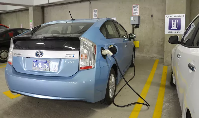 A car being charged at an electric vehicle charger in Ann Arbor. - Susan Montgomery / Shutterstock.com