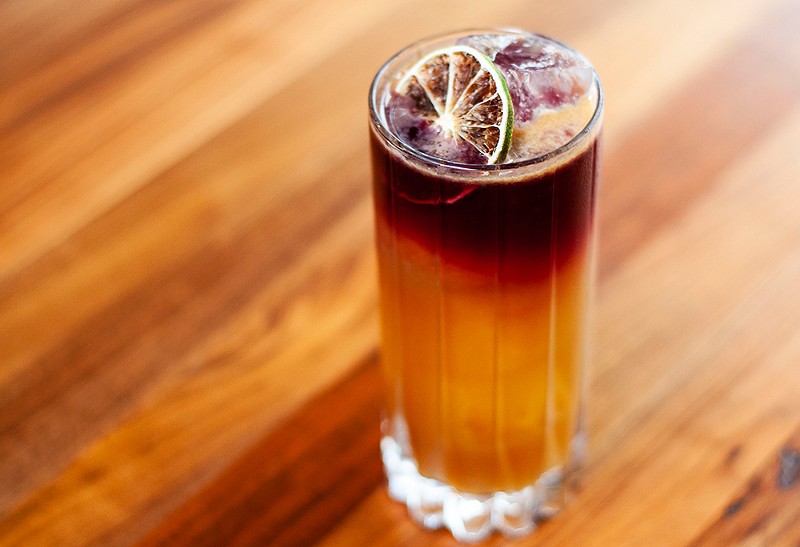 The Bennie's Plan cocktail has Navy Strength Rum, Chinese Rhubarb Amaro, falernum, lime, and mulled wine. - TOM PERKINS