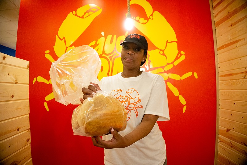 In the bag: Saucey Crab owner Angie Middleton has seafood boil restaurants in Detroit and Southfield. - SE7ENFIFTEEN