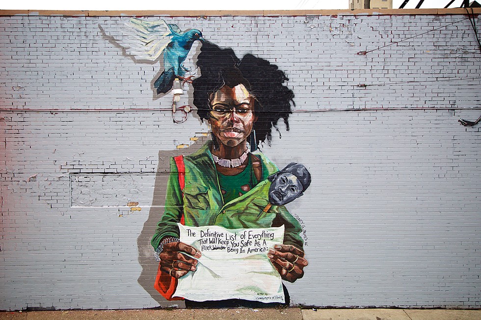 "Black List" by Sydney G. James (2016); wall painting, 15 x 25 feet; Eastern Market, Division and Orleans. The mask and the pigeon are references to the visual languages of artists Tylonn Sawyer and Rashaun Rucker, respectively. The words are by poet Scheherazade Washington Parrish. All three are James's friends and frequent collaborators.