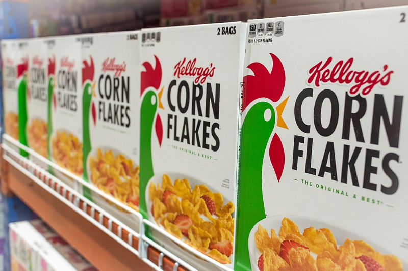 Kellog's Corn Flakes on display at an aisle in a supermarket. - MDV Edwards / Shutterstock.com