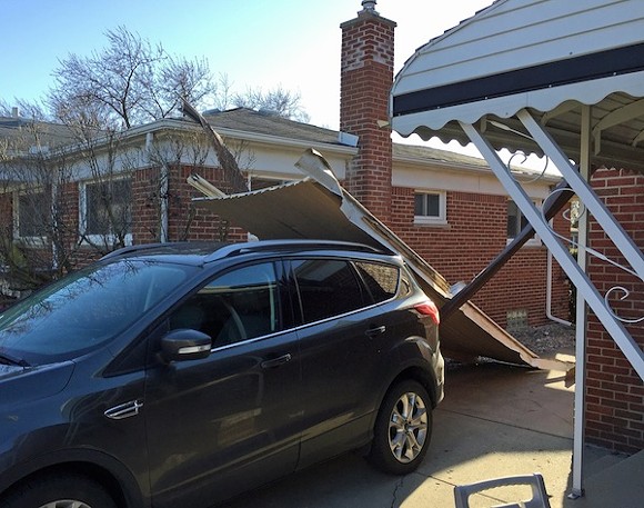 Reader Donald Calamia sent us this picture of his car wearing his neighbor's house's awning. - Photo courtesy Donald Calamia