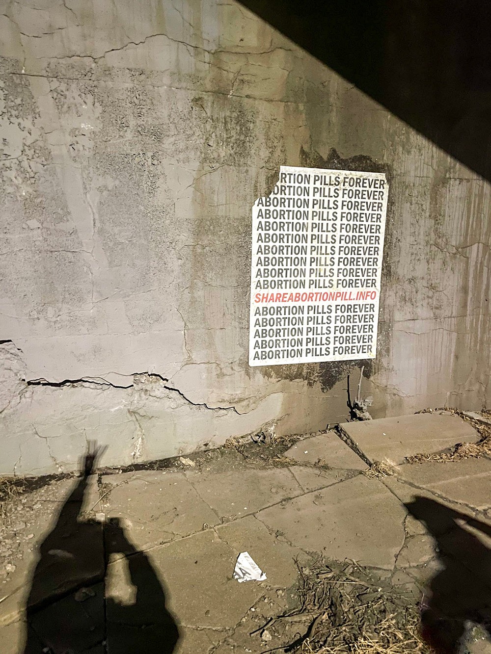 Someone already tried to take one of the abortion pill posters down, but the wheatpaste held up. - COURTESY PHOTO