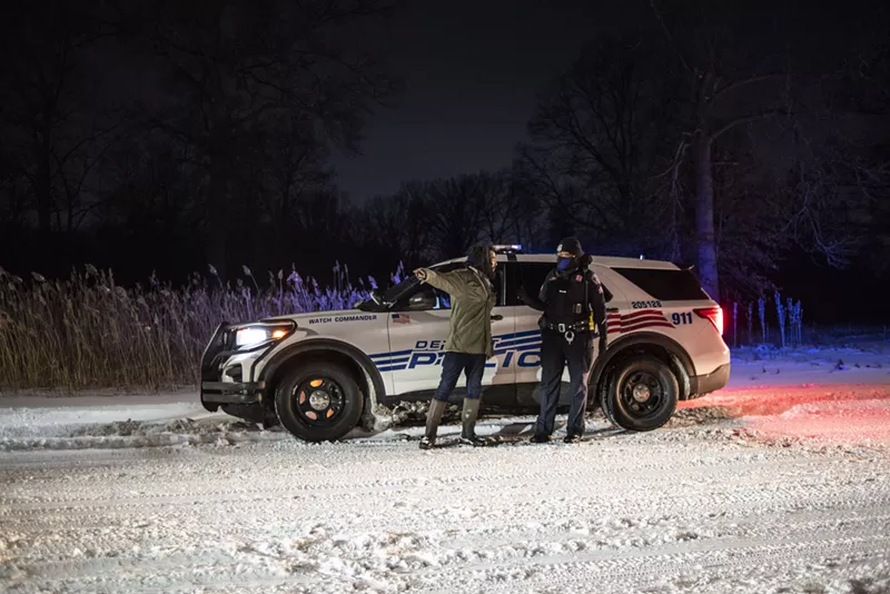 Detroit Sugarbush Project organizer Antonio Cosme speaking with police on Friday, Feb. 18. - Courtesy of Rosa María Zamarrón