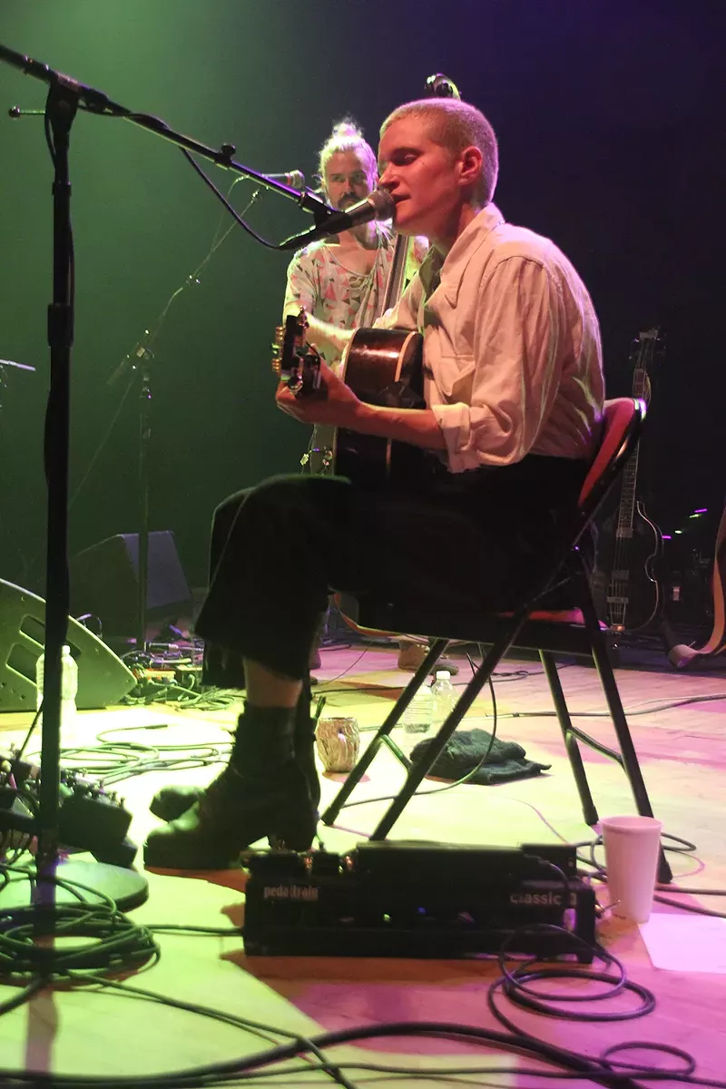 Adrianne Lenker said a back injury caused her to perform an acoustic set from a wooden chair at the Royal Oak Music Theatre. - JAMESON DRAPER