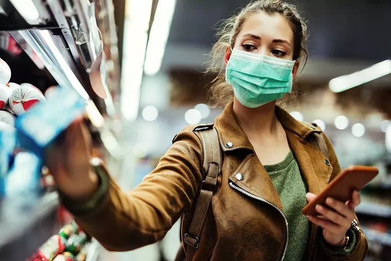 You might want to mask up again indoors, according to the CDC. - Shutterstock