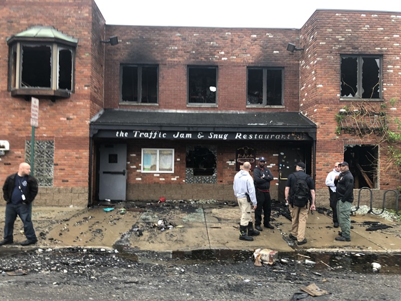 Metro Times observed heavy damage at Midtown's Traffic Jam & Snug restaurant on Friday morning, including broken windows and debris strewn across Canfield Street.