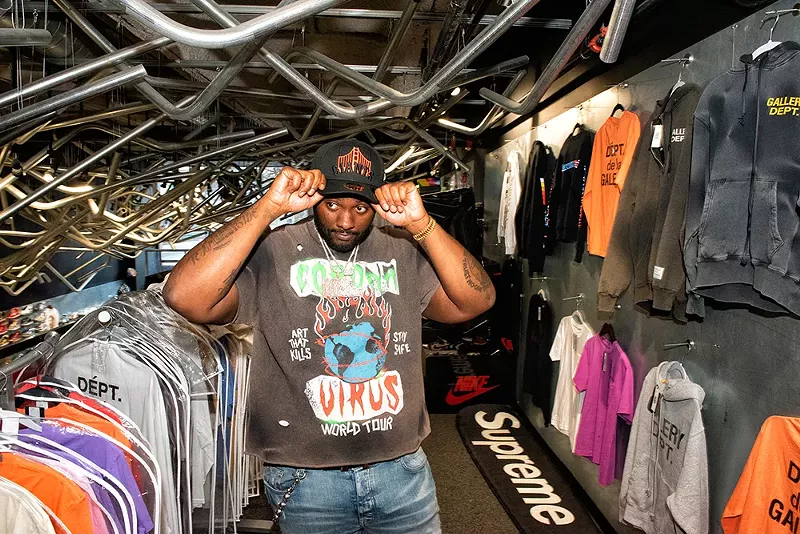 Peezy shopping at Nojo Kicks in downtown Detroit. - Kahn Santori Davison