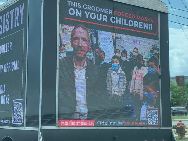 Digital mobile billboard makes outrageous claims about Oakland County Executive David Coulter. - Photo via tipster