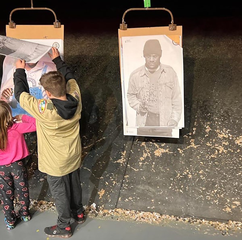 A photo taken by a parent during a Boy Scouts troop visit to the Farmington Hills Police Department shows targets used for shooting practice printed with images of Black men. The department says it uses targets depicting all kinds of people, though it apologized. - Courtesy photo
