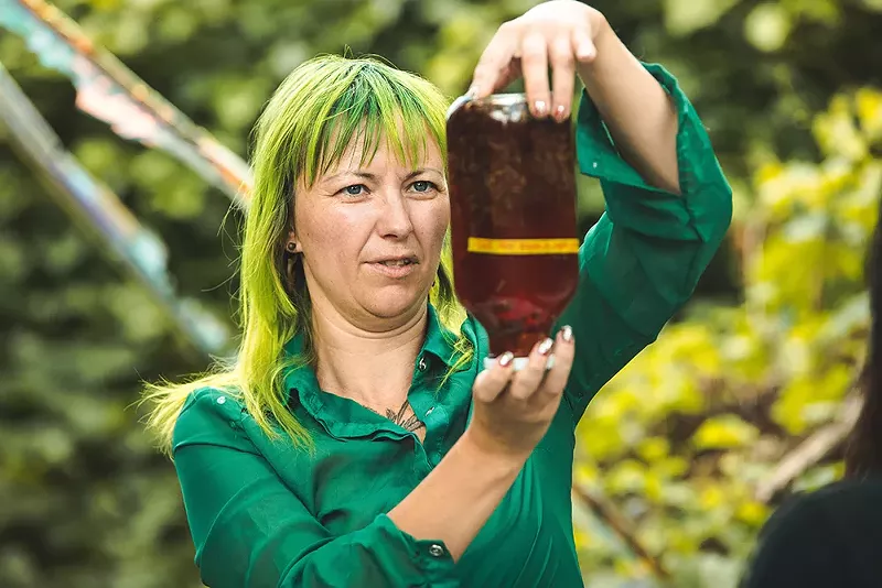Zarah Akcerwoman of Herbalists Without Borders teaches how to make a medicinal tincture with Hypericum perforatum and 100-proof vodka. The plant is often used to treat anxiety and seasonal depression. - Marc Klockow