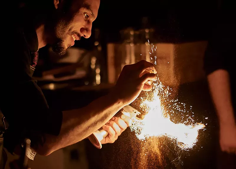 Yani Frye prepares a creative cocktail at FRAMEbar. - Joe Vaughn