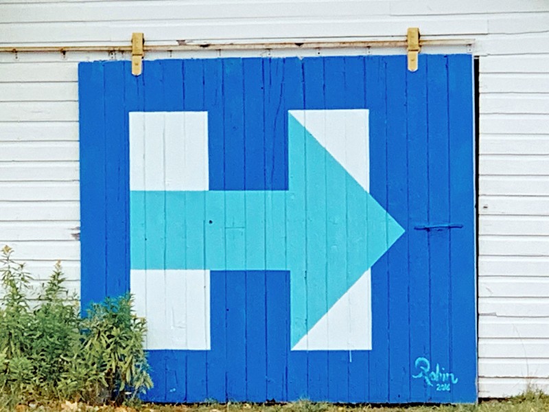 A garage door in Leelanau County still has Hillary Clinton’s 2016 presidential campaign logo, Sept. 12, 2019. - Susan J. Demas