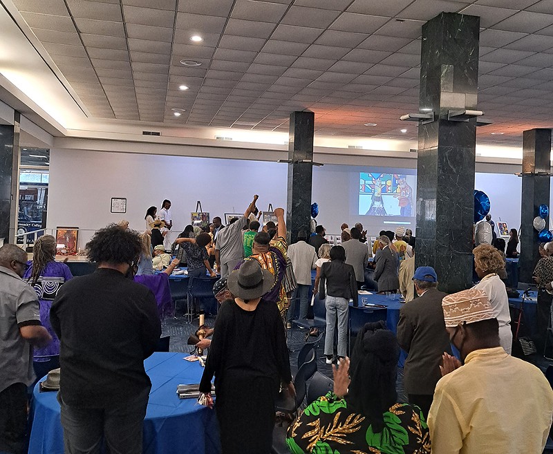 A room full of family and friends shared tears, roaring laughter, funny stories, and touching memories of Detroit artist Aaron Ibn Pori Pitts at Wayne County Community College. - Amber Ogden