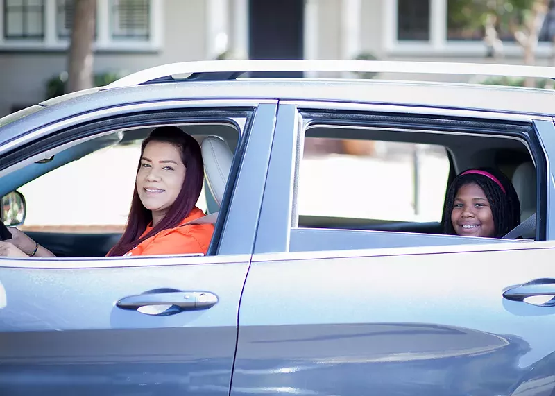 HopSkipDrive is like Uber, but for taking children to school. Its drivers undergo extensive background checks and wear a bright orange shirt. - Courtesy photo