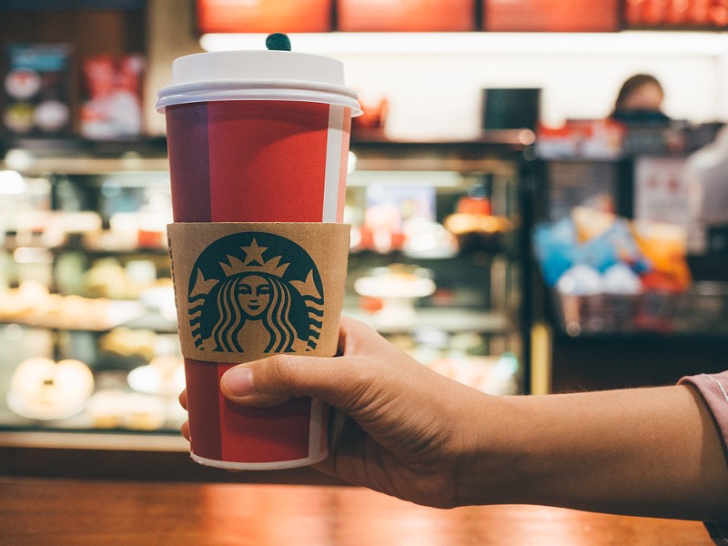 The striking workers are demonstrating outside of their stores, giving out Starbucks Workers United branded cups instead of the chain's reusable red cups. - Prachana Thong-on/ Shutterstock