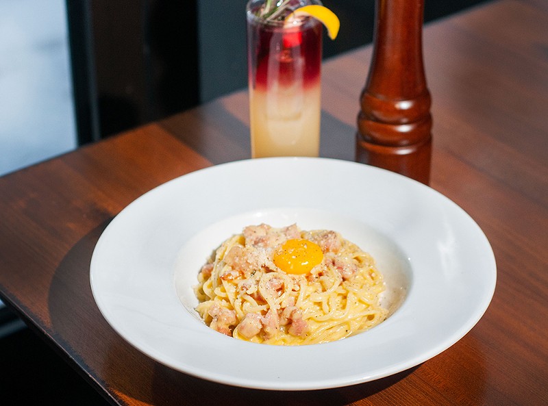 Pastaio places a glistening egg yolk atop its carbonara, which you break up yourself. It’s lovely and it works. - Tom Perkins
