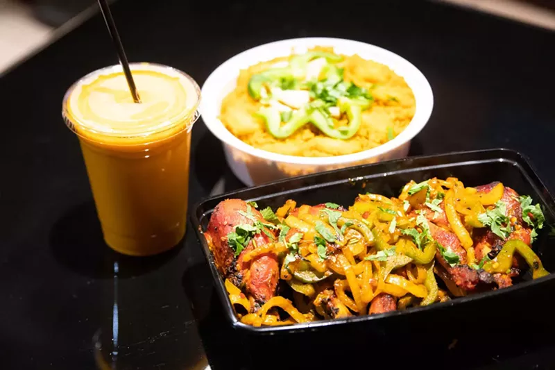 Tandoori chicken, shrimp biryani, and mango lassi from Pink Garlic in Oak Park. - Viola Klocko