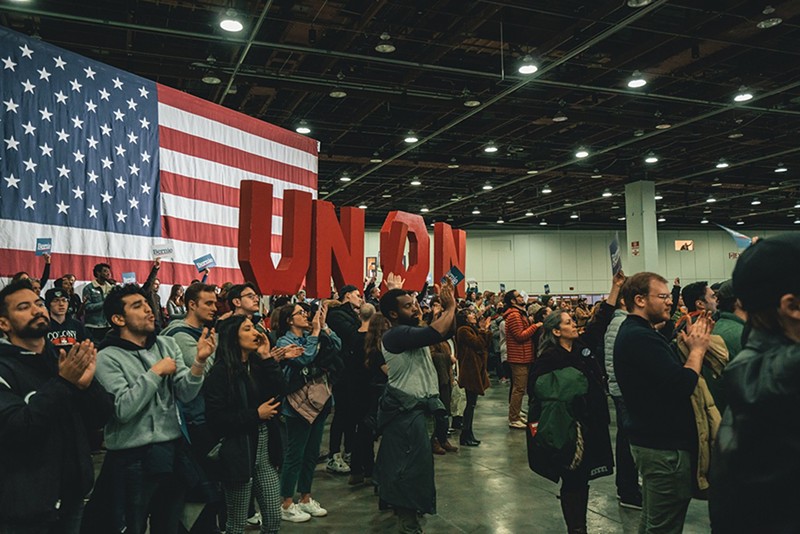 Supporters hold a sign that reads “UNION” during a rally for then-presidential candidate Bernie Sanders in Detroit in March 2020. - John Sippel