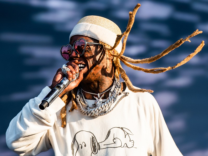 Lil' Wayne performs at Lollapalooza in Grant Park, Chicago. - Ted Alexander Somerville / Shutterstock