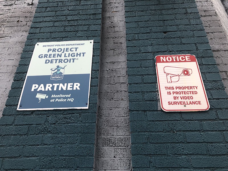 A sign indicating a business in Detroit is participating in Project Green Light. - Lee DeVito