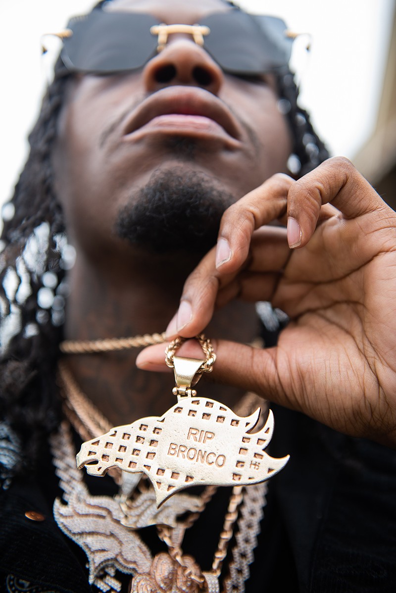 Snap Dogg wears a necklace in honor of Bronco, his twin brother. - Kahn Santori Davison