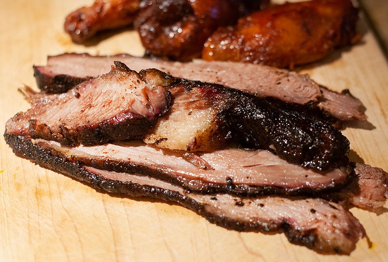 Mouth-watering brisket is priced by the pound at Royal Oak’s Holiday Market. - Tom Perkins