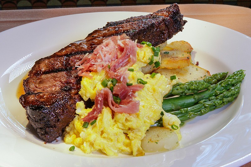 A rib chop, potatoes, asparagus, and corn from Brentwood Grille. - Courtesy photo